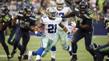 Aug 25, 2016; Seattle, WA, USA; Dallas Cowboys running back Ezekiel Elliott (21) picks up a first down during the first quarter during a preseason game against the Seattle Seahawks at CenturyLink Field. Mandatory Credit: Troy Wayrynen-USA TODAY Sports