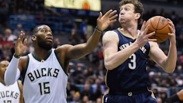 Mar 12, 2016; Milwaukee, WI, USA; New Orleans Pelicans center Omer Asik (3) grabs a rebound against Milwaukee Bucks center Greg Monroe (15) in the first quarter at BMO Harris Bradley Center. Mandatory Credit: Benny Sieu-USA TODAY Sports