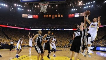 May 10, 2013; Oakland, CA, USA; Golden State Warriors point guard Stephen Curry (30) shoots the ball against San Antonio Spurs center Tiago Splitter (22) during the first quarter of game three of the second round of the 2013 NBA Playoffs at Oracle Arena. The Spurs defeated the Warriors 102-92. Mandatory Credit: Kyle Terada-USA TODAY Sports