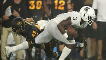TEMPE, AZ - SEPTEMBER 08: Running back LJ Scott #3 of the Michigan State Spartans rushes the football past safety Jalen Harvey #43 of the Arizona State Sun Devils during the college football game at Sun Devil Stadium on September 8, 2018 in Tempe, Arizona. The Sun Devils defeated the Spartans 16-13. (Photo by Christian Petersen/Getty Images)