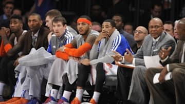 Jan 17, 2014; New York, NY, USA; New York Knicks small forward Carmelo Anthony (headband) and teammates look on against the Los Angeles Clippers during the second half at Madison Square Garden. The Los Angeles Clippers won 109-94. Mandatory Credit: Joe Camporeale-USA TODAY Sports