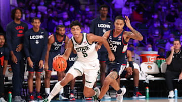 Nov 25, 2021; Nassau, BHS; Michigan State Spartans guard Max Christie (5) drives to the basket past Connecticut Huskies guard Jordan Hawkins (24) during the first half in the 2021 Battle 4 Atlantis at Imperial Arena. Mandatory Credit: Kevin Jairaj-USA TODAY Sports