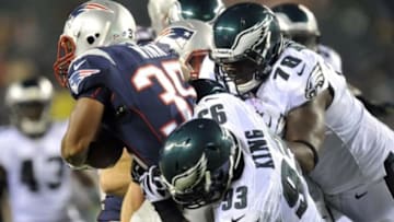 Aug 9, 2013; Philadelphia, PA, USA; Philadelphia Eagles defensive end David King (93) and Philadelphia Eagles tackle Matt Kopa (78) tackle New England Patriots running back George Winn (35) during the second half of a preseason game at Lincoln Financial Field. The Patriots won 31-22. Mandatory Credit: Joe Camporeale-USA TODAY Sports