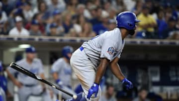 SAN DIEGO, CA - JULY 9: Andrew Toles #60 of the Los Angeles Dodgers hits a single during the eighth inning of a baseball game against the San Diego Padres at PETCO Park on July 9, 2018 in San Diego, California. (Photo by Denis Poroy/Getty Images)