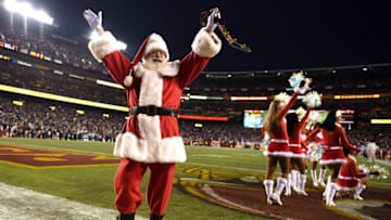 LANDOVER, MD - DECEMBER 20: Santa Claus acknowledges the crowd as the Philadelphia Eagles play the Washington Redskins at FedExField on December 20, 2014 in Landover, Maryland. The Washington Redskins won, 27-24. (Photo by Patrick Smith/Getty Images)
