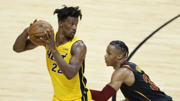Jimmy Butler #22 of the Miami Heat is defended by Isaac Okoro #35 of the Cleveland Cavaliers(Photo by Michael Reaves/Getty Images)