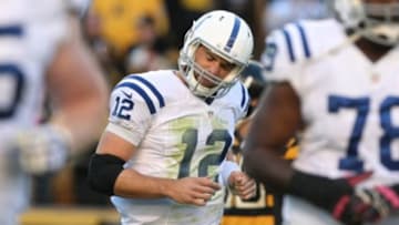 Oct 26, 2014; Pittsburgh, PA, USA; Indianapolis Colts quarterback Andrew Luck (12) reacts to throwing an interception for a touchdown against the Pittsburgh Steelers during the first half of their game at Heinz Field. Mandatory Credit: Jason Bridge-USA TODAY Sports