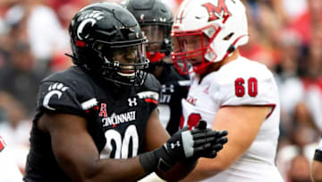 Cincinnati Bearcats linebacker Jabari Taylor celebrates against the Miami RedHawks. The Enquirer.