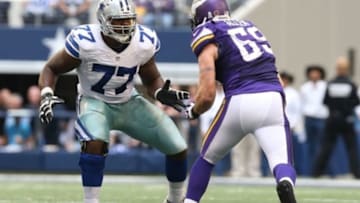 Nov 3, 2013; Arlington, TX, USA; Dallas Cowboys tackle Tyron Smith (77) in action against Minnesota Vikings defensive end Jared Allen (69) at AT&T Stadium. Mandatory Credit: Matthew Emmons-USA TODAY Sports