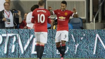 Jul 21, 2015; San Jose, CA, USA; Manchester United midfielder Memphis Depay (9) celebrates with forward Wayne Rooney (10) after a goal against the San Jose Earthquakes during the first half at Avaya Stadium. Mandatory Credit: Kelley L Cox-USA TODAY Sports