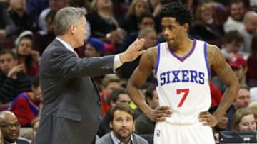 Jan 16, 2015; Philadelphia, PA, USA; Philadelphia 76ers head coach Brett Brown talks with guard Larry Drew II (7) in a game against the New Orleans Pelicans at Wells Fargo Center. The 76ers defeated the Pelicans 96-81. Mandatory Credit: Bill Streicher-USA TODAY Sports