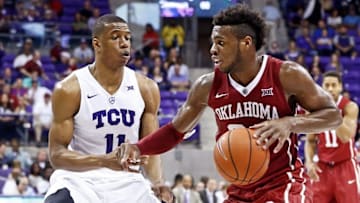 Mar 5, 2016; Fort Worth, TX, USA; Oklahoma Sooners guard Buddy Hield (24) dribbles as TCU Horned Frogs guard Brandon Parrish (11) defends during the second half at Ed and Rae Schollmaier Arena. Mandatory Credit: Kevin Jairaj-USA TODAY Sports