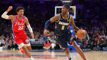 PHILADELPHIA, PA - MARCH 14: Will Barton #5 of the Denver Nuggets dribbles the ball against Matisse Thybulle #22 of the Philadelphia 76ers at the Wells Fargo Center on March 14, 2022 in Philadelphia, Pennsylvania. The Nuggets defeated the 76ers 114-110. NOTE TO USER: User expressly acknowledges and agrees that, by downloading and or using this photograph, User is consenting to the terms and conditions of the Getty Images License Agreement. (Photo by Mitchell Leff/Getty Images)