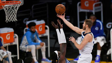 LOS ANGELES, CA - DECEMBER 27: Montrezl Harrell #15 of the Los Angeles Lakers guards Jake Layman #10 of the Minnesota Timberwolves at Staples Center on December 27, 2020 in Los Angeles, California. NOTE TO USER: User expressly acknowledges and agrees that, by downloading and/or using this photograph, user is consenting to the terms and conditions of the Getty aImages License Agreement. (Photo by John McCoy/Getty Images)