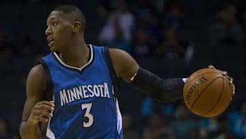 Oct 10, 2016; Charlotte, NC, USA; Minnesota Timberwolves guard Kris Dunn (3) dribbles the ball during the first quarter against the Charlotte Hornets at Time Warner Cable Arena. The Hornets won 98-86. Mandatory Credit: Joshua S. Kelly-USA TODAY Sports
