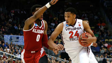 PITTSBURGH, PA - MARCH 15: Kerry Blackshear Jr. #24 of the Virginia Tech Hokies drives to the basket against Donta Hall #0 of the Alabama Crimson Tide during the second half of the game in the first round of the 2018 NCAA Men's Basketball Tournament at PPG PAINTS Arena on March 15, 2018 in Pittsburgh, Pennsylvania. (Photo by Justin K. Aller/Getty Images)