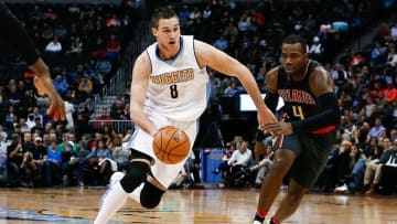 Jan 25, 2016; Denver, CO, USA; Denver Nuggets forward Danilo Gallinari (8) drives to the basket against Atlanta Hawks forward Paul Millsap (4) in the third quarter at the Pepsi Center. The Hawks defeated the Nuggets 119-105. Mandatory Credit: Isaiah J. Downing-USA TODAY Sports
