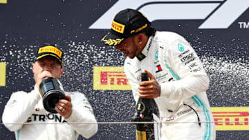 LE CASTELLET, FRANCE - JUNE 23: Race winner Lewis Hamilton of Great Britain and Mercedes GP and second placed Valtteri Bottas of Finland and Mercedes GP celebrate on the podium during the F1 Grand Prix of France at Circuit Paul Ricard on June 23, 2019 in Le Castellet, France. (Photo by Mark Thompson/Getty Images)