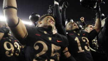 PHILADELPHIA, PENNSYLVANIA - DECEMBER 08: Caleb John #25 and Chris Skyers #13 of the Army Black Knights celebrate after Army defeats Navy Midshipmen 17-10 at Lincoln Financial Field on December 08, 2018 in Philadelphia, Pennsylvania. (Photo by Sarah Stier/Getty Images)
