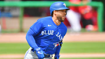 CLEARWATER, FLORIDA - MARCH 20: George Springer #4 of the Toronto Blue Jays runs to first after hitting a single off of Matt Moore of the Philadelphia Phillies in the first inning of a spring training game on March 20, 2021 at BayCare Ballpark in Clearwater, Florida. (Photo by Julio Aguilar/Getty Images)