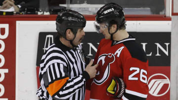 Mar 20, 2009; Newark, NJ, USA; New Jersey Devils left wing Patrik Elias (26) talks to Referee Bill McCreary (7) during the third period at the Prudential Center. The Devils defeated the Wild 4-0. Mandatory Credit: Ed Mulholland-USA TODAY Sports