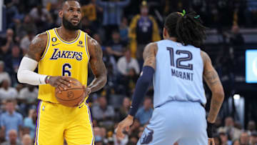 MEMPHIS, TENNESSEE - APRIL 26: LeBron James #6 of the Los Angeles Lakers handles the ball against Ja Morant #12 of the Memphis Grizzlies during Game Five of the Western Conference First Round Playoffs at FedExForum on April 26, 2023 in Memphis, Tennessee. NOTE TO USER: User expressly acknowledges and agrees that, by downloading and or using this photograph, User is consenting to the terms and conditions of the Getty Images License Agreement. (Photo by Justin Ford/Getty Images)