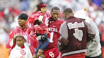 Dec 3, 2016; Norman, OK, USA; Oklahoma Sooners wide receiver Dede Westbrook (11) with his family on senior day before the game against the Oklahoma State Cowboys at Gaylord Family - Oklahoma Memorial Stadium. Mandatory Credit: Kevin Jairaj-USA TODAY Sports