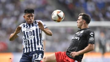 MONTERREY, MEXICO - APRIL 27: Jesús Gallardo, #17 of Monterrey, fights for the ball with Fernando Meza #5 of Necaxa during the 16th round match between Monterrey and Necaxa as part of the Torneo Clausura 2019 Liga MX at BBVA Bancomer Stadium on April 27, 2019 in Monterrey, Mexico. (Photo by Azael Rodriguez/Getty Images)
