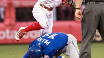 Jun 16, 2016; Philadelphia, PA, USA; Philadelphia Phillies second baseman Cesar Hernandez (16) throws to first for a double play after tagging out Toronto Blue Jays center fielder Kevin Pillar (11) during the third inning at Citizens Bank Park. Mandatory Credit: Bill Streicher-USA TODAY Sports