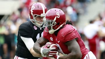Apr 16, 2016; Tuscaloosa, AL, USA; Alabama Crimson Tide quarterback David Cornwell (12) hands the ball off to Alabama Crimson Tide running back Bo Scarbrough (9) at Bryant-Denny Stadium. Mandatory Credit: Marvin Gentry-USA TODAY Sports