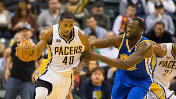Nov 21, 2016; Indianapolis, IN, USA; Indiana Pacers guard Glenn Robinson III (40) is fouled by Golden State Warriors forward Draymond Green (23) in the second half of the game at Bankers Life Fieldhouse. Golden State beat Indiana 120-83. Mandatory Credit: Trevor Ruszkowski-USA TODAY Sports