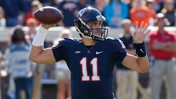 Oct 25, 2014; Charlottesville, VA, USA; Virginia Cavaliers quarterback Greyson Lambert (11) throws the ball against the North Carolina Tar Heels at Scott Stadium. Mandatory Credit: Geoff Burke-USA TODAY Sports