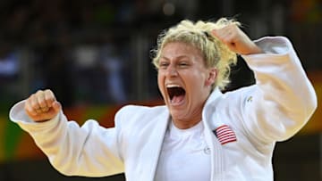 US Kayla Harrison celebrates after defeating France's Audrey Tcheumeo during their women's -78kg judo contest gold medal match of the Rio 2016 Olympic Games in Rio de Janeiro on August 11, 2016. / AFP / Toshifumi KITAMURA (Photo credit should read TOSHIFUMI KITAMURA/AFP via Getty Images)