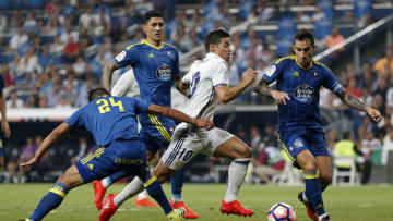 MADRID, SPAIN - AUGUST 27: James Rodriguez of Real Madrid competes for the ball with Facundo Roncaglia (L) and Hugo Mallo of Celta de Vigo during the La Liga match between Real Madrid CF and RC Celta de Vigo at Estadio Santiago Bernabeu on August 27, 2016 in Madrid, Spain. (Photo by Angel Martinez/Real Madrid via Getty Images)