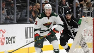 January 21, 2016; Los Angeles, CA, USA; Minnesota Wild center Charlie Coyle (3) moves the puck against Los Angeles Kings defenseman Drew Doughty (8) during the first period at Staples Center. Mandatory Credit: Gary A. Vasquez-USA TODAY Sports