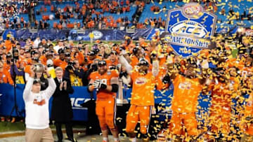 Dec 5, 2015; Charlotte, NC, USA; Clemson Tigers head coach Dabo Swinney (L) holds up the trophy for fans after winning the ACC football championship game at Bank of America Stadium. The Tigers won 45-37. Mandatory Credit: Jim Dedmon-USA TODAY Sports