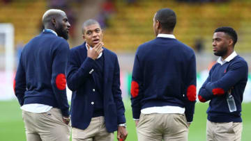 MONACO - MAY 03: Kylian Mbappe of AS Monaco speaks with his team mates as they inspect the pitch prior to the UEFA Champions League Semi Final first leg match between AS Monaco v Juventus at Stade Louis II on May 3, 2017 in Monaco, Monaco. (Photo by Michael Steele/Getty Images)