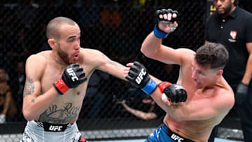 LAS VEGAS, NEVADA - NOVEMBER 13: (L-R) Sean Woodson punches Collin Anglin in a featherweight fight during the UFC Fight Night event at UFC APEX on November 13, 2021 in Las Vegas, Nevada. (Photo by Chris Unger/Zuffa LLC)