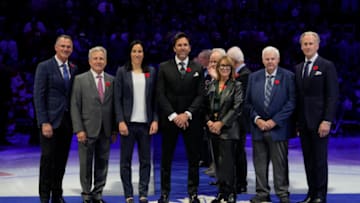 Nov 10, 2023; Toronto, Ontario, CAN; Hockey Hall of Fame Class of 2023 inductees Pierre Turgeon, Mike Vernon, Caroline Ouellette, Henrik Lundqvist, Coco Lacroix for her husband Pierre , Ken Hitchcock, and Tom Barrasso (left to right) before the start of the game between the Calgary Flames and Toronto Maple Leafs at Scotiabank Arena. Mandatory Credit: John E. Sokolowski-USA TODAY Sports