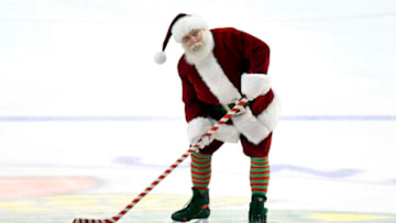 CHICAGO, IL - DECEMBER 23: Santa Clause shoots the puck before the start of the third period of a game between the Colorado Avalanche and the Chicago Blackhawks on December 23, 2016, at the United Center in Chicago, IL. (Photo by Robin Alam/Icon Sportswire via Getty Images)