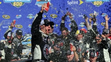March 15, 2015; Avondale, AZ, USA; Sprint Cup Series driver Kevin Harvick (4) celebrates his victory of the CampingWorld.com 500 at Phoenix International Raceway. Mandatory Credit: Gary A. Vasquez-USA TODAY Sports