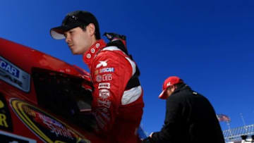 Feb 19, 2015; Daytona Beach, FL, USA; NASCAR Sprint Cup Series driver Kyle Larson (42) gets into his car during practice for the Daytona 500 at Daytona International Speedway. Mandatory Credit: Andrew Weber-USA TODAY Sports