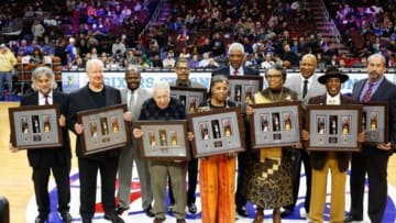 Dec 5, 2014; Philadelphia, PA, USA; Former players and members of the 76ers family during a halftime ceremony celebrating the USPS release of the commemorative Wilt Chamberlain stamp during a game against the Oklahoma City Thunder at Wells Fargo Center. Mandatory Credit: Bill Streicher-USA TODAY Sports