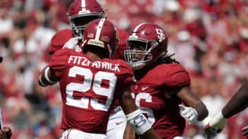 Sep 24, 2016; Tuscaloosa, AL, USA; Alabama Crimson Tide linebacker Tim Williams (56) and defensive back Minkah Fitzpatrick (29) celebrate after tackling Kent State Golden Flashes quarterback Mylik Mitchell (not pictured) at Bryant-Denny Stadium. Mandatory Credit: Marvin Gentry-USA TODAY Sports