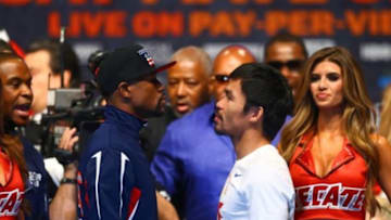 May 1, 2015; Las Vegas, NV, USA; Floyd Mayweather (left) stares at Manny Pacquiao during weigh-ins for the upcoming boxing fight at MGM Grand Garden Arena. Mandatory Credit: Mark J. Rebilas-USA TODAY Sports