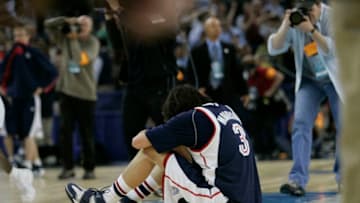 Gonzaga forward Adam Morrison sits dejected on the court following a last second 7371 loss to UCLA at the Oakland Region Semifinals at Oakland Arena, Thursday, March 23, 2006. (Photo by Robert Gauthier/Los Angeles Times via Getty Images)