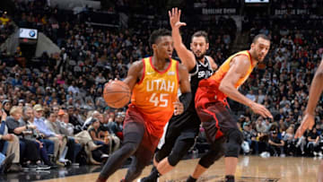 SAN ANTONIO, TX - DECEMBER 9: Donovan Mitchell #45 of the Utah Jazz drives to the basket against the San Antonio Spurs on December 9, 2018 at the AT&T Center in San Antonio, Texas. NOTE TO USER: User expressly acknowledges and agrees that, by downloading and or using this photograph, user is consenting to the terms and conditions of the Getty Images License Agreement. Mandatory Copyright Notice: Copyright 2018 NBAE (Photos by Mark Sobhani/NBAE via Getty Images)