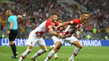 MOSCOW, RUSSIA - JULY 15: Ivan Perisic of Croatia celebrates with team mate Ante Rebic after scoring his team's first goal during the 2018 FIFA World Cup Final between France and Croatia at Luzhniki Stadium on July 15, 2018 in Moscow, Russia. (Photo by Shaun Botterill/Getty Images)