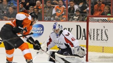 Sep 16, 2013; Philadelphia, PA, USA; Washington Capitals goalie David Leggio (40) makes a save against Philadelphia Flyers defenseman Matt Konan (34) during the second period of preseason game at the Wells Fargo Center. Mandatory Credit: Eric Hartline-USA TODAY Sports