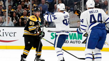 BOSTON, MA - OCTOBER 22: Boston Bruins left wing Brad Marchand (63) and Toronto Maple Leafs defenseman Tyson Barrie (94) mix it up during a game between the Boston Bruins and the Toronto Maple Leafs on October 22, 2019, at TD Garden in Boston, Massachusetts. (Photo by Fred Kfoury III/Icon Sportswire via Getty Images)